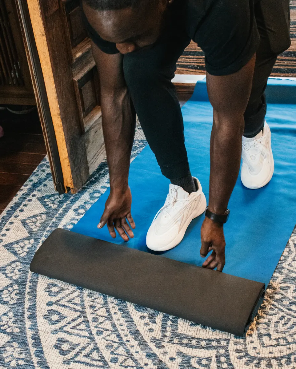 Mover placing floor protection at a doorway before a Maryland move