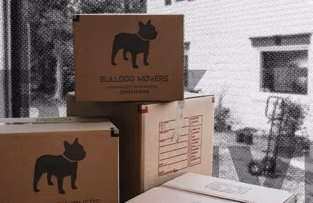 Stacked Bulldog Movers boxes for an organized relocation