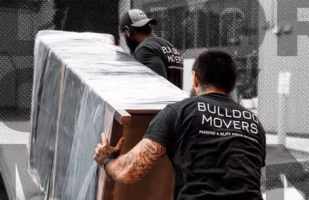 Bulldog Movers wrapping and lifting furniture