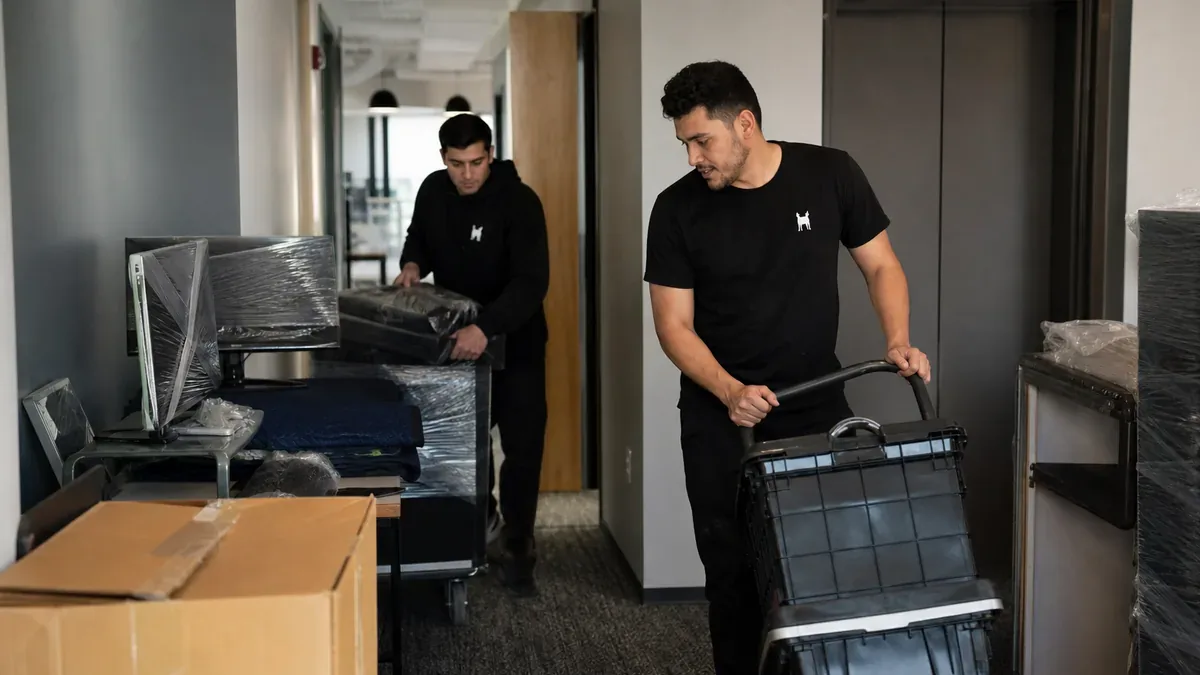 Bulldog Movers crew moving office equipment for a commercial relocation
